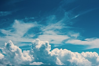 white clouds under blue sky at daytime cloudy teams background