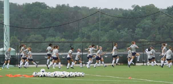 Players warming up on the field just before kickoff.