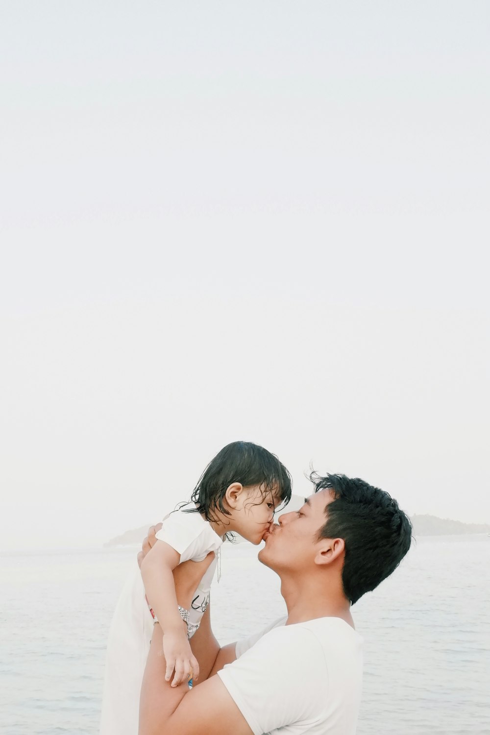 Man kissing toddler during daytime photo – Free Daughter Image on ...