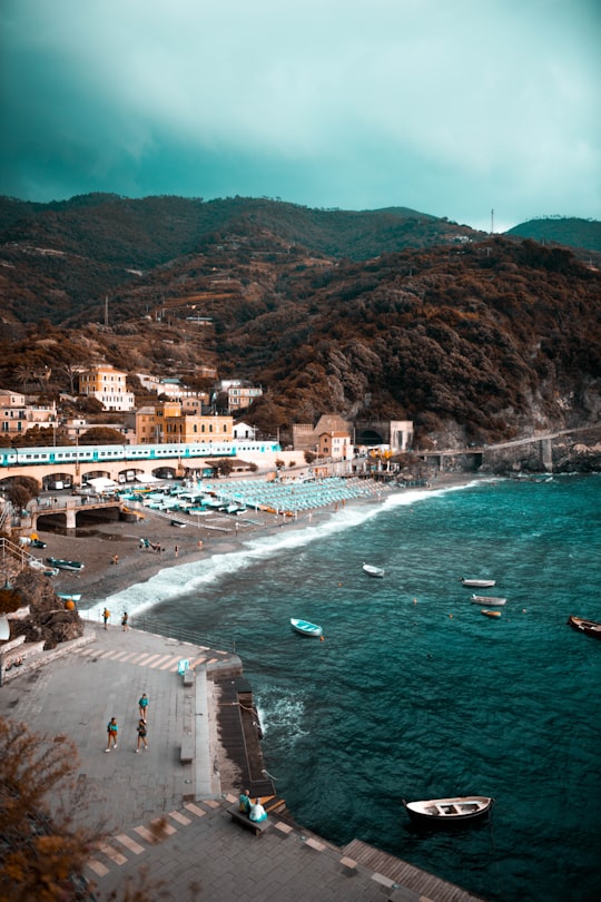 white concrete building near body of water in Parco Nazionale delle Cinque Terre Italy