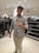 A satisfied customer wearing fashionable attire from Swiftstore.