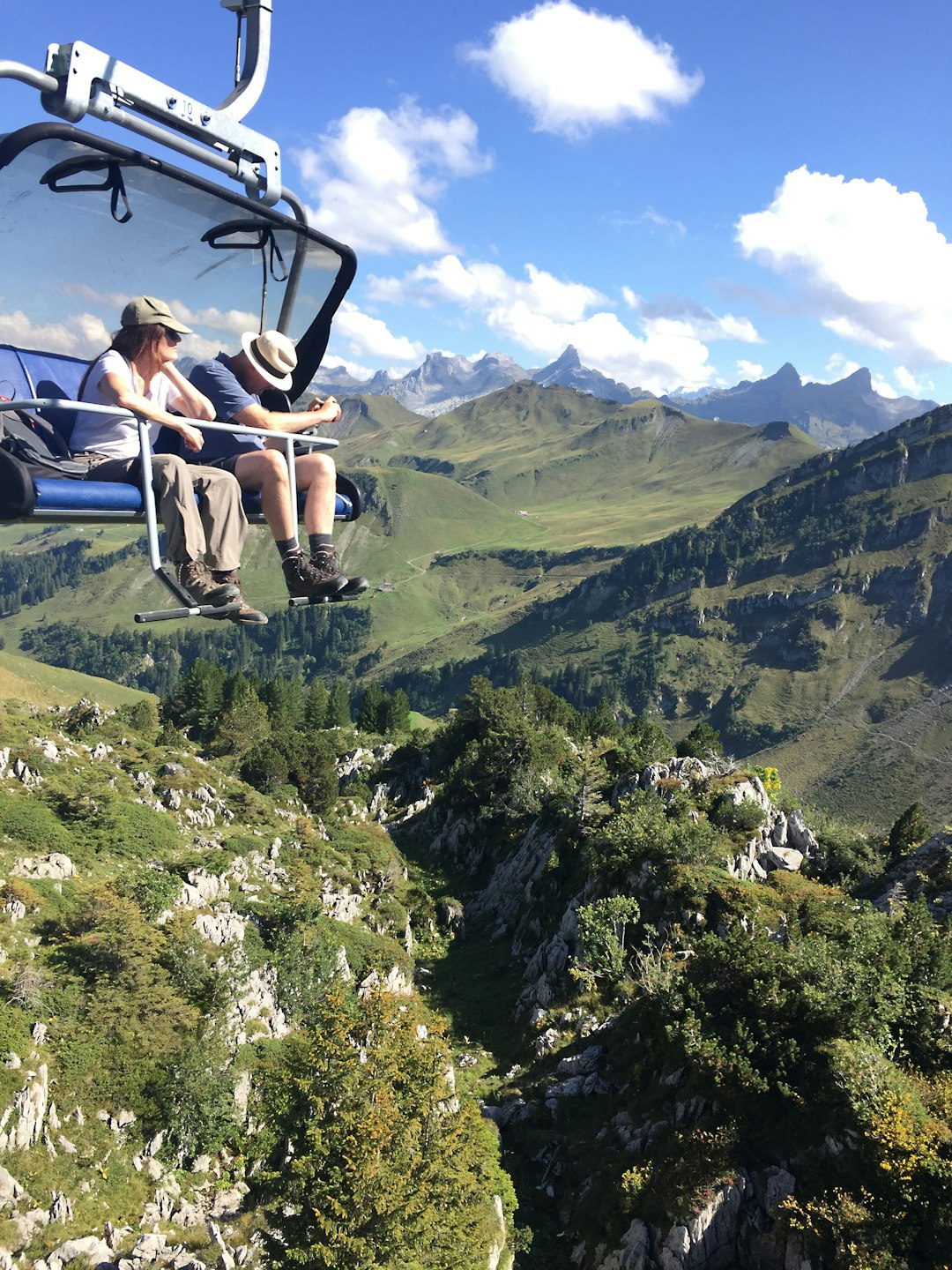 two person riding on cable car