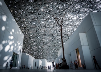 people standing between building wall