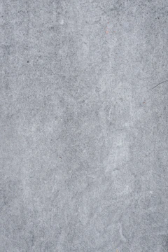 Smooth polished concrete surface with subtle color variations and a glossy finish