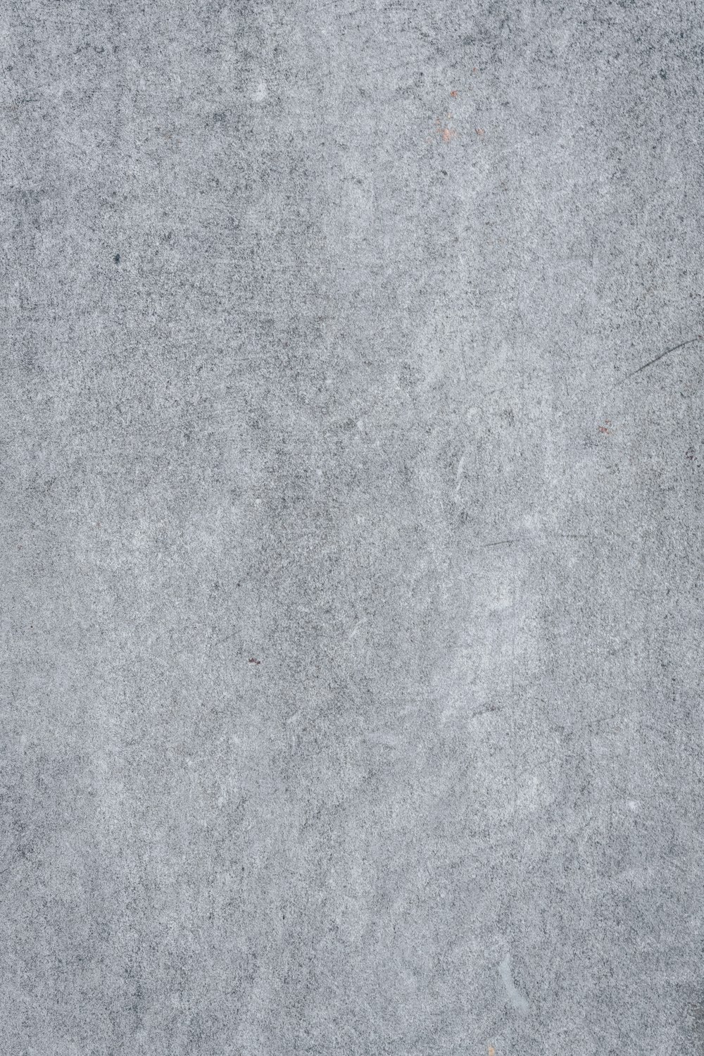 a close up of a gray concrete surface