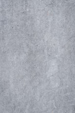 a close up of a gray concrete surface