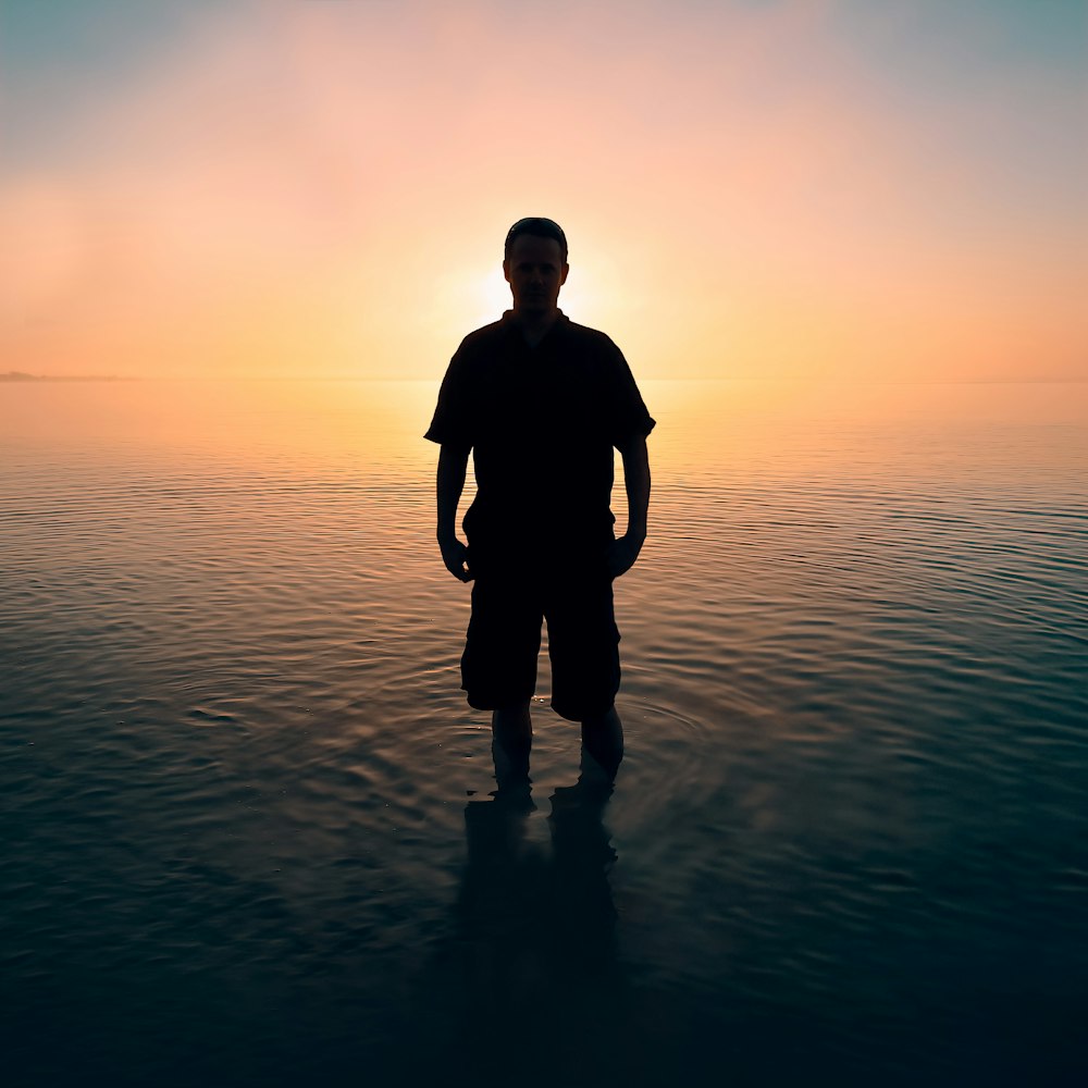 man standing on body of water