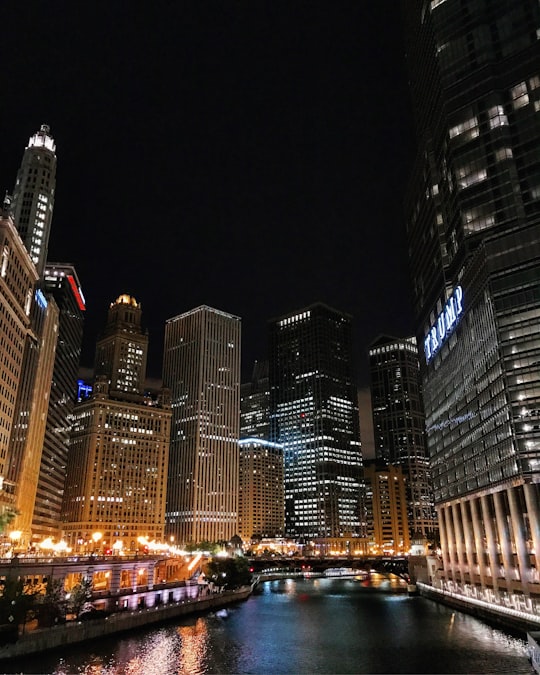 city buildings during nighttime in Chicago Riverwalk United States