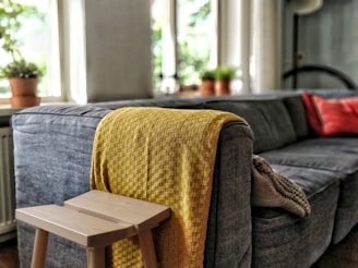 yellow textile on couch