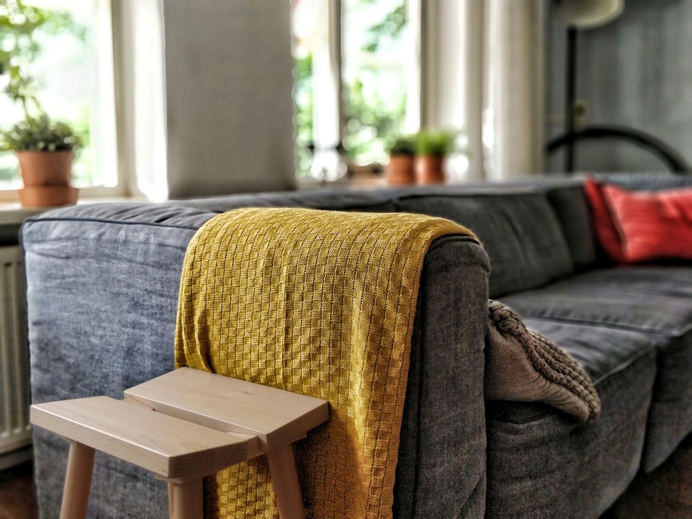 yellow textile on couch