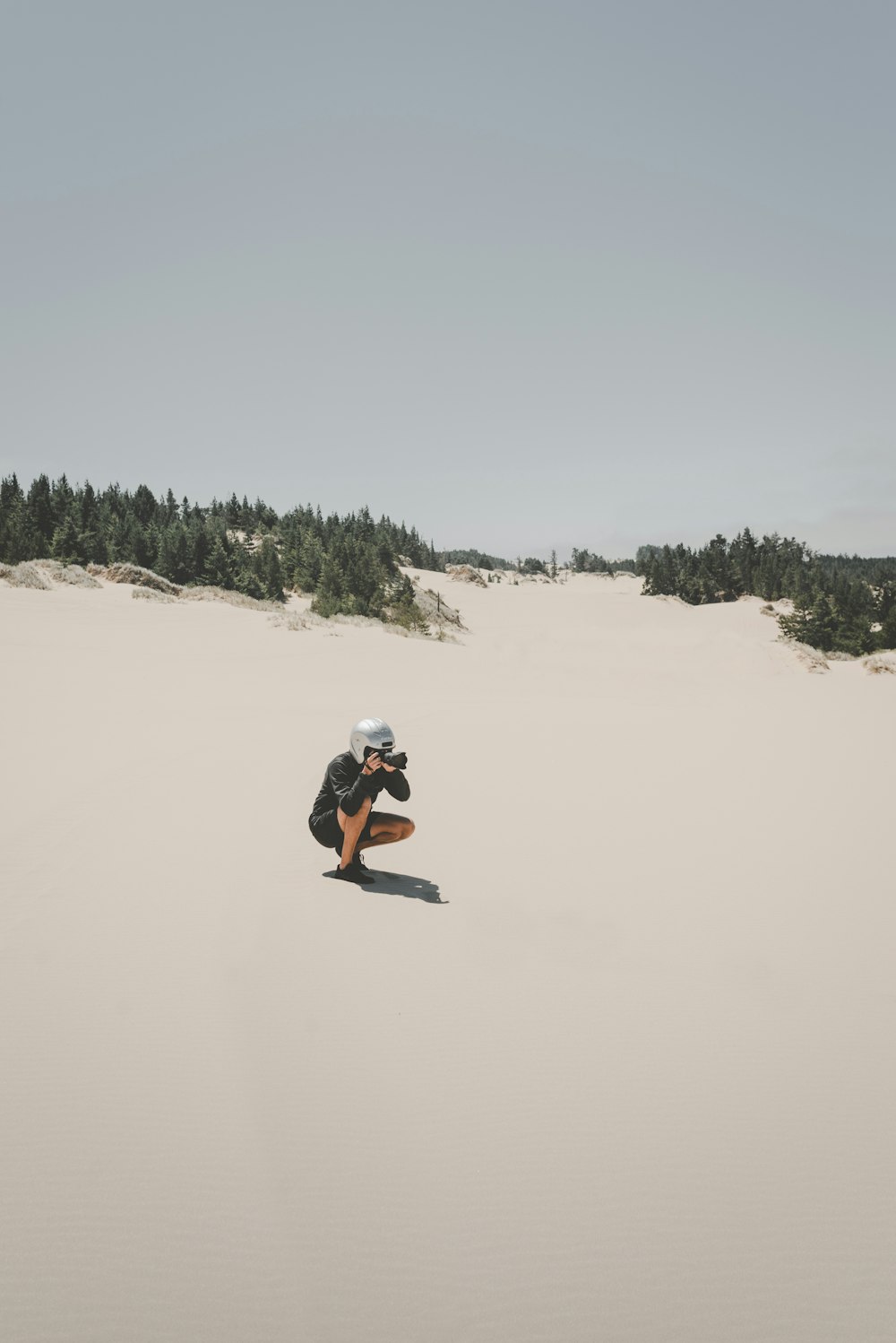 person wearing helmet taking photo