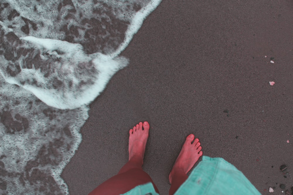 person standing on shore during day