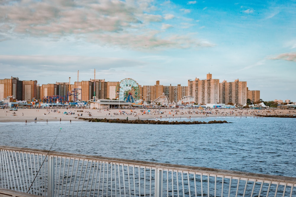 white ferris wheel near buildings