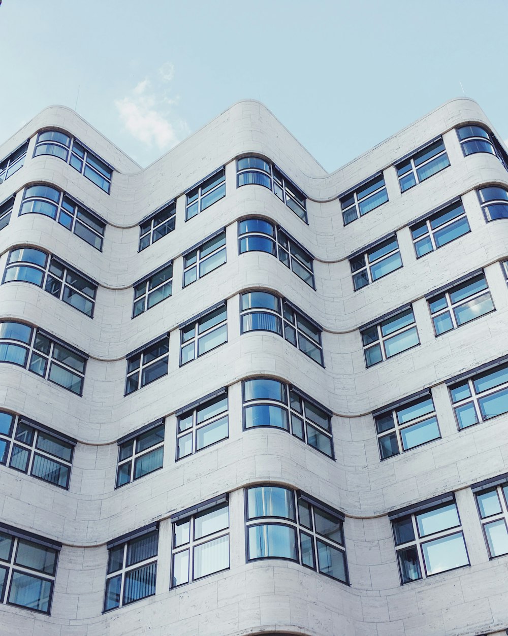 white concrete building under blue sky