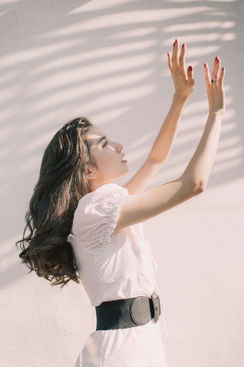 woman raising hands