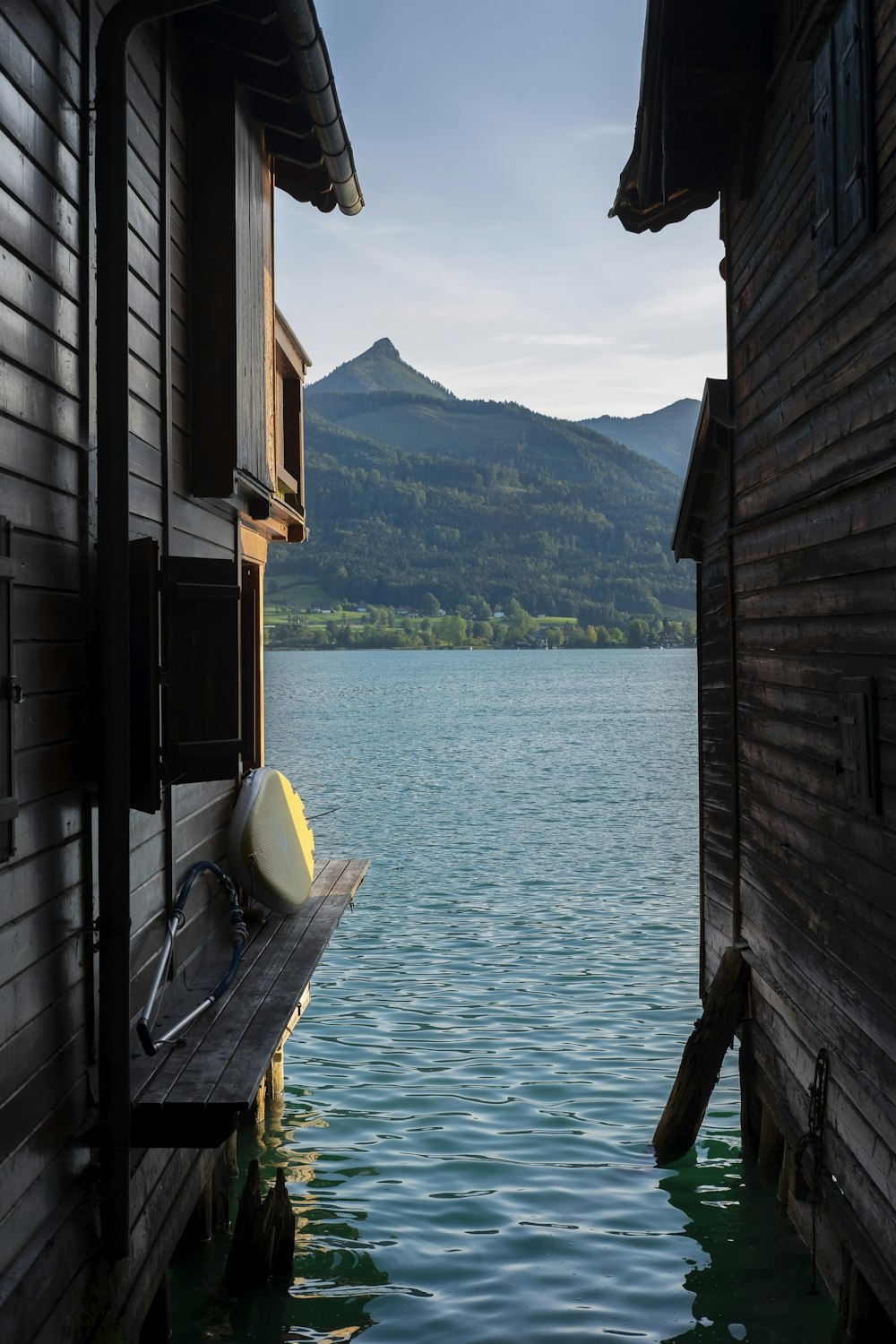 gray wooden house on body of water