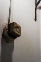Close-up of hands replacing an electrical switch safely.