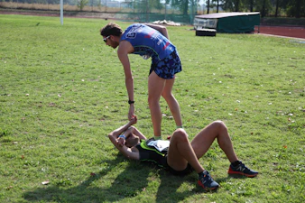 Young athletes showing respect to their elders after a game.