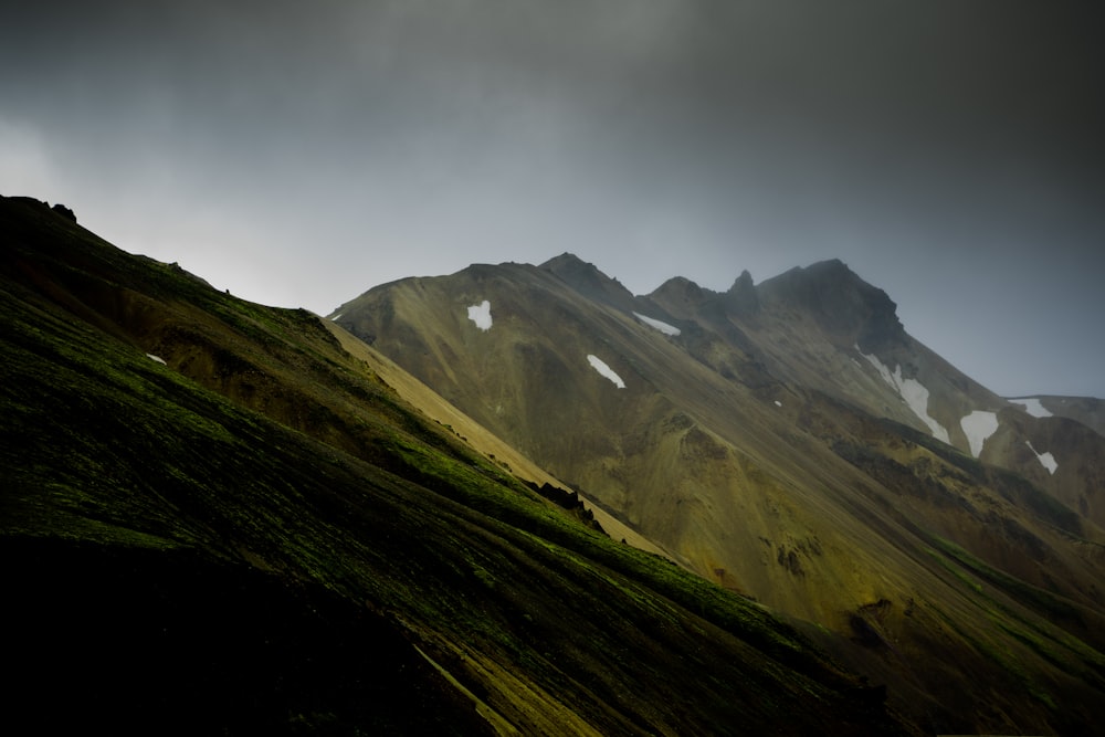 green mountains during foggy daytime landscape photography