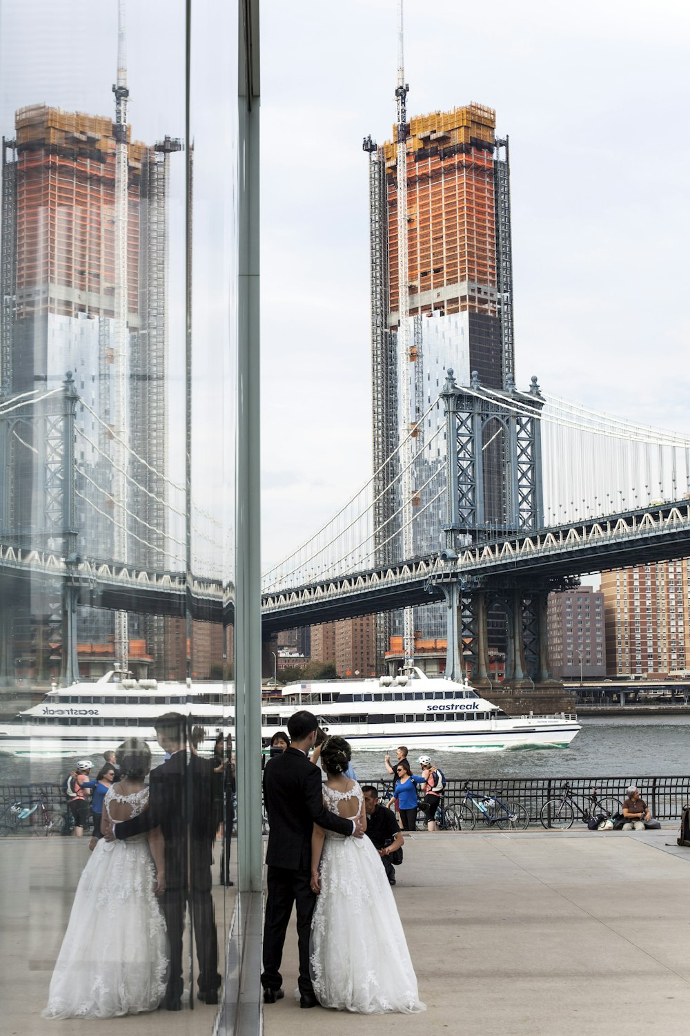 man and woman standing beside building