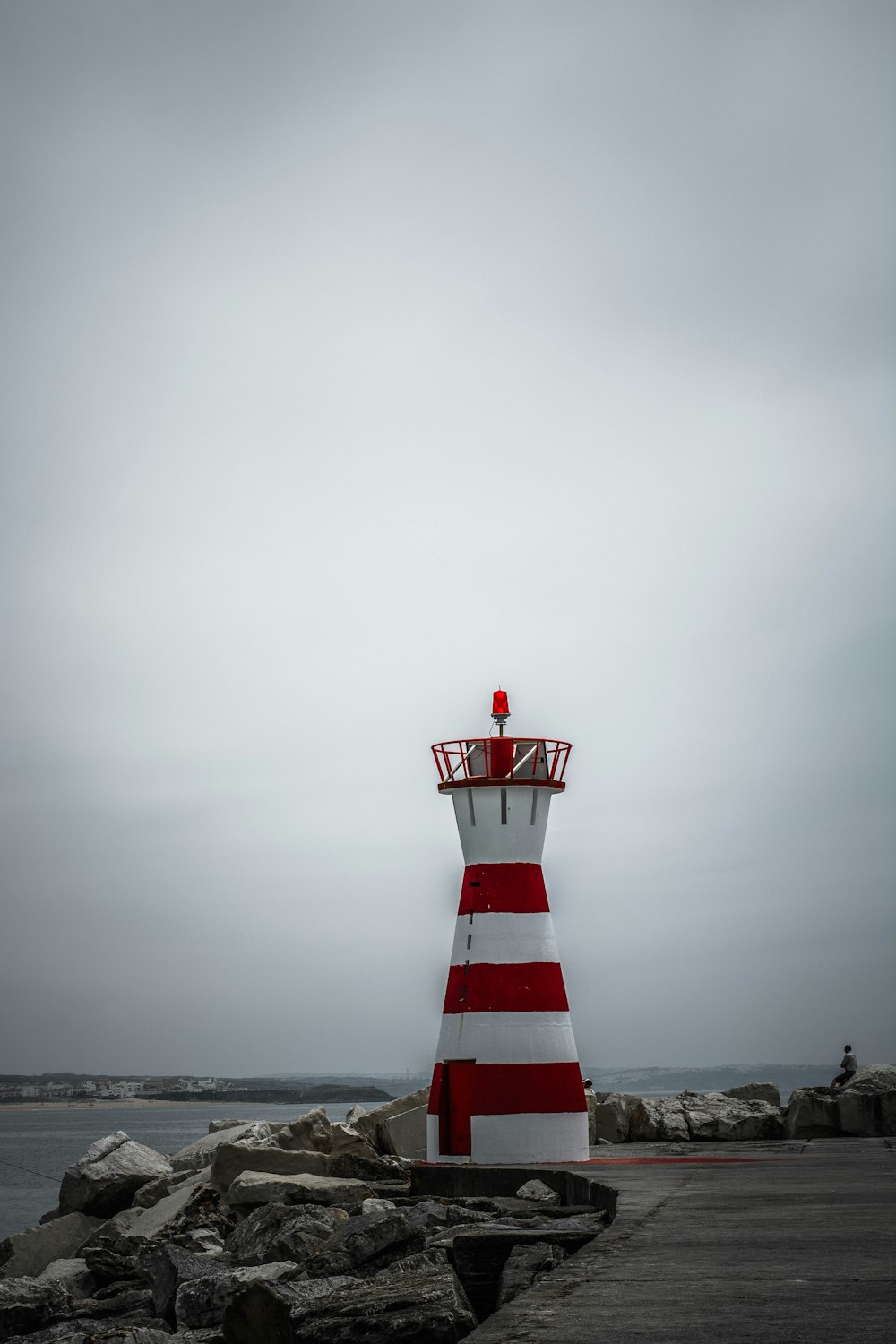 white and red lighthouse during daytime photography