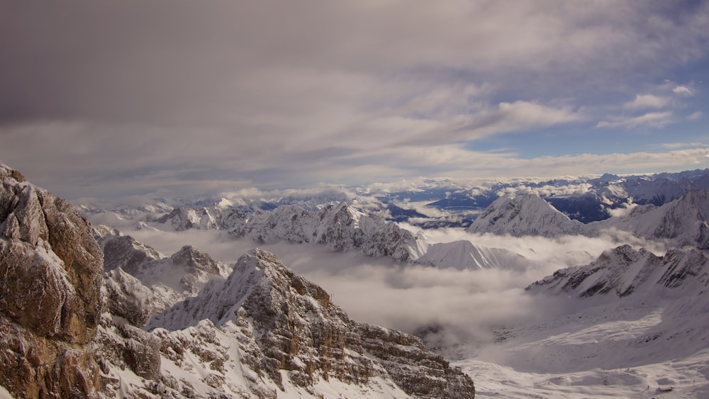 mountains under white clouds during daytime