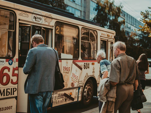 A vibrant group of travelers boarding a comfortable bus ready for an exciting excursion.