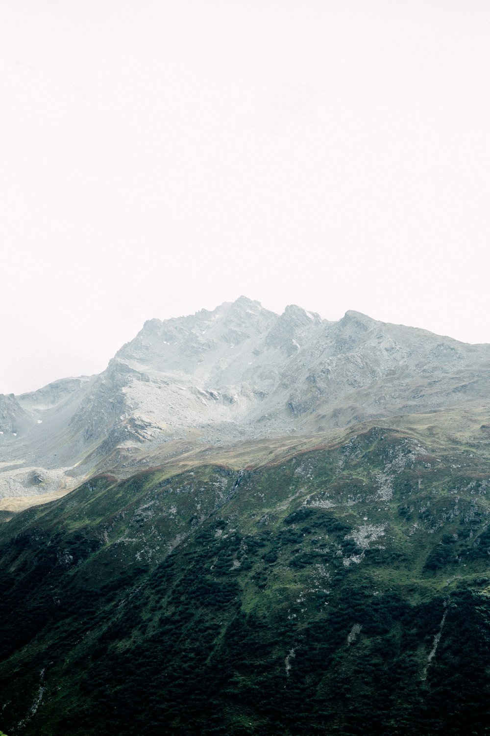 top view of mountain under white sky