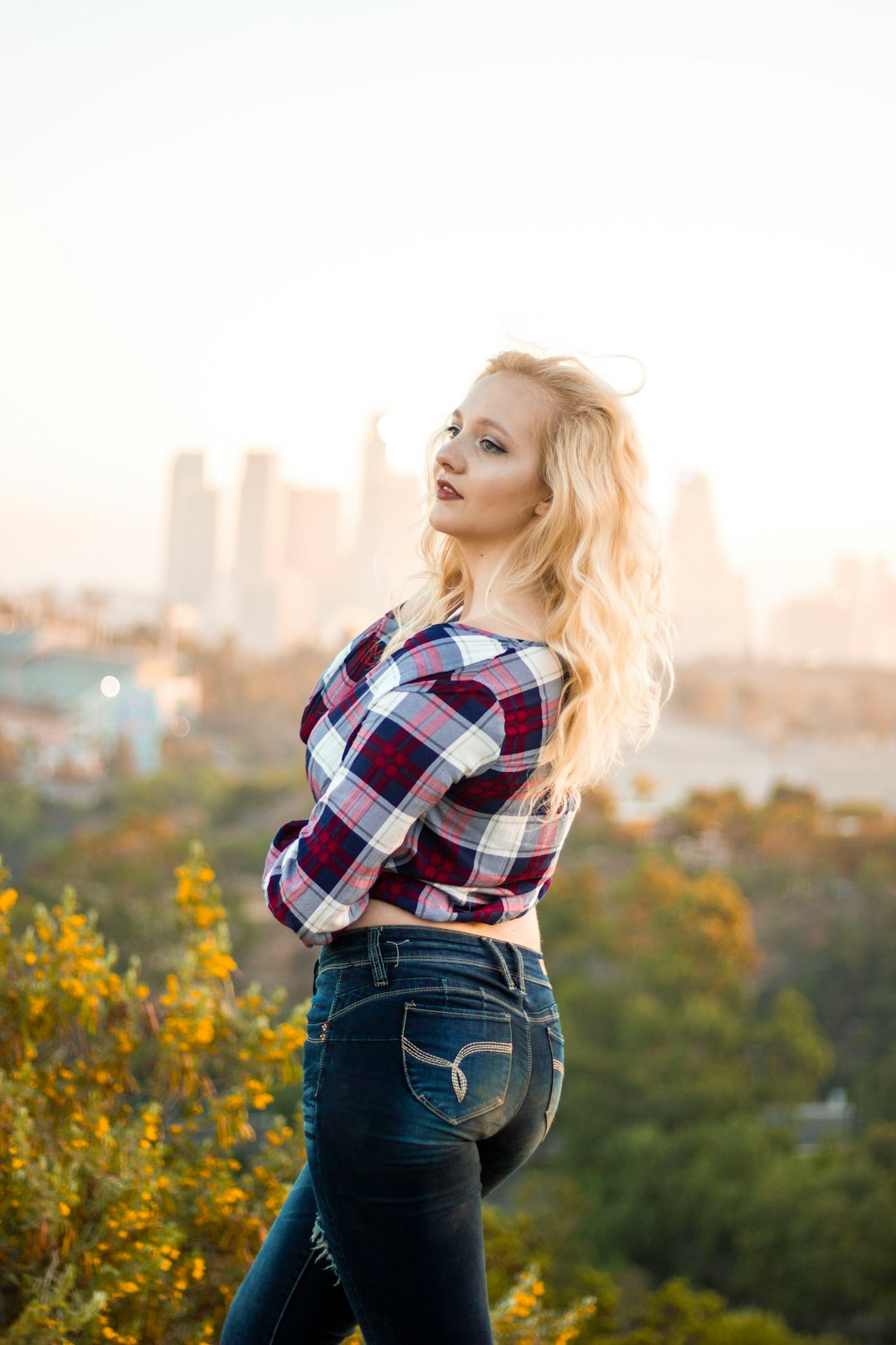 woman posing while looking at left side outdoors