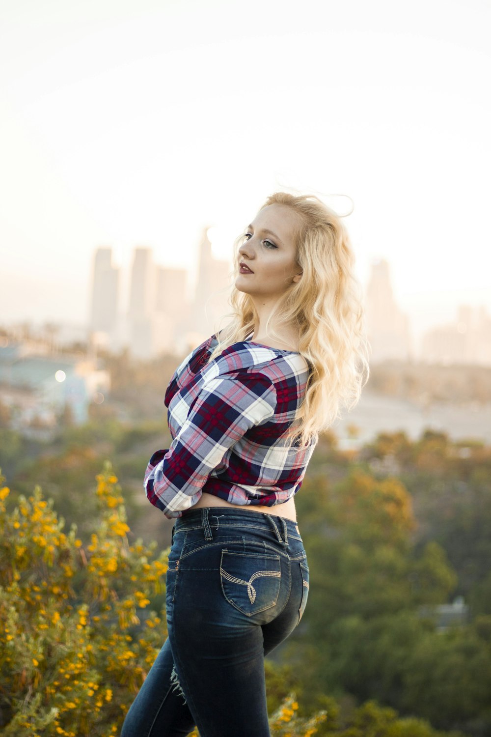 woman posing while looking at left side outdoors