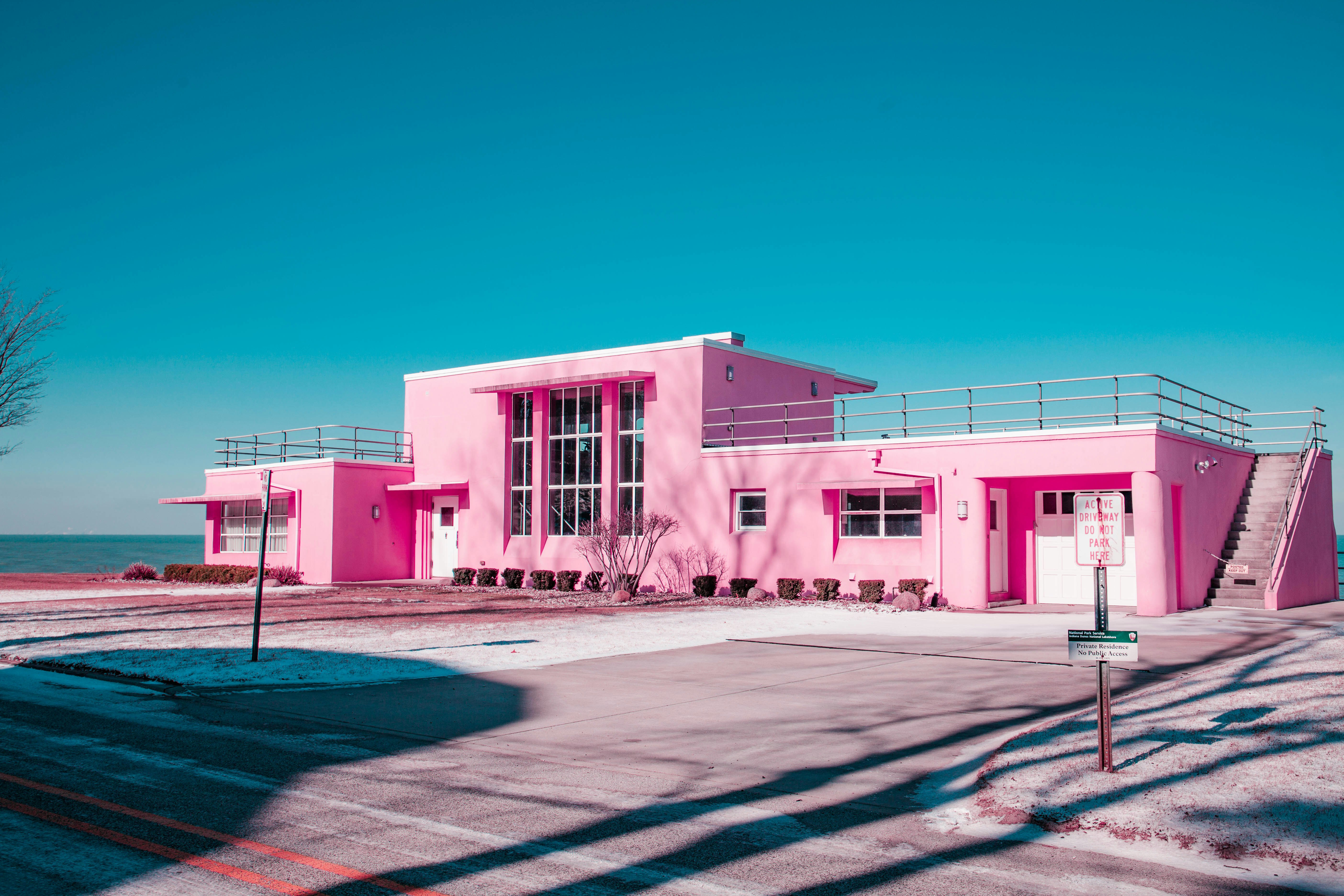 pink concrete building under clear blue sky