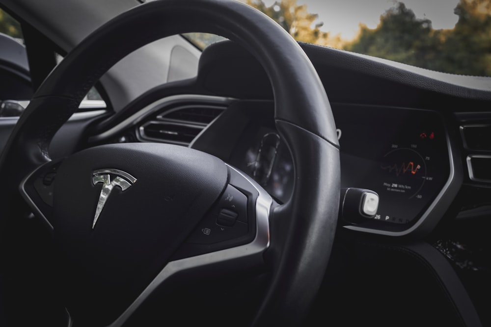 close-up photo of black vehicle steering wheel