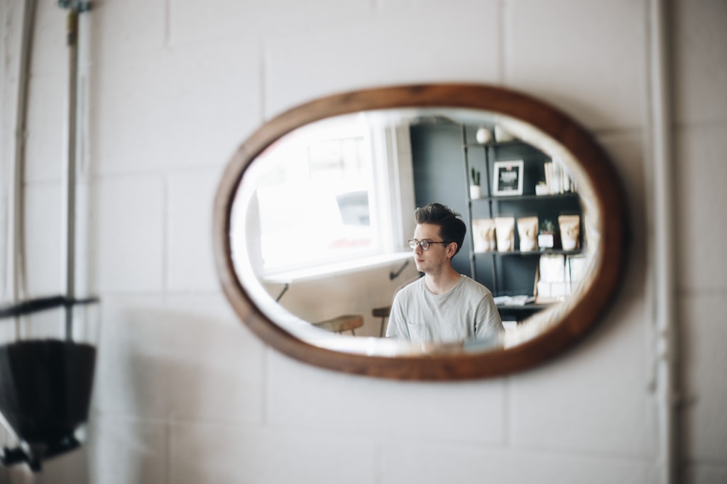 How can wall mirrors make your room look more spacious