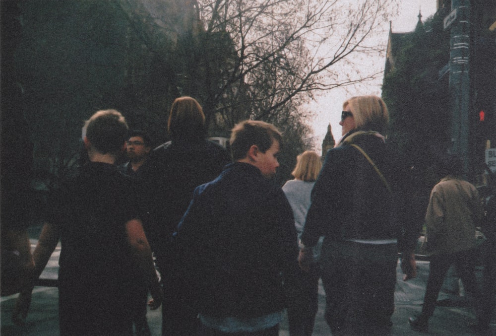 group of people walking on street