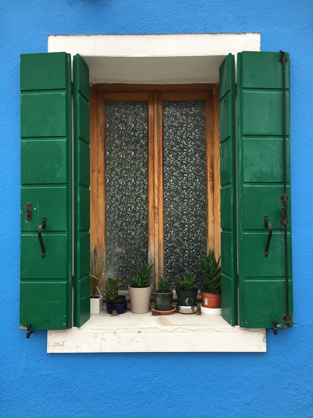 closed brown wooden window