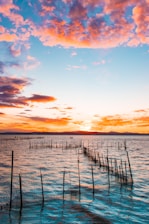 fish pen on ocean at golden hour