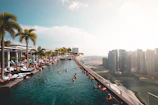 group of people at the swimming pool under white clouds