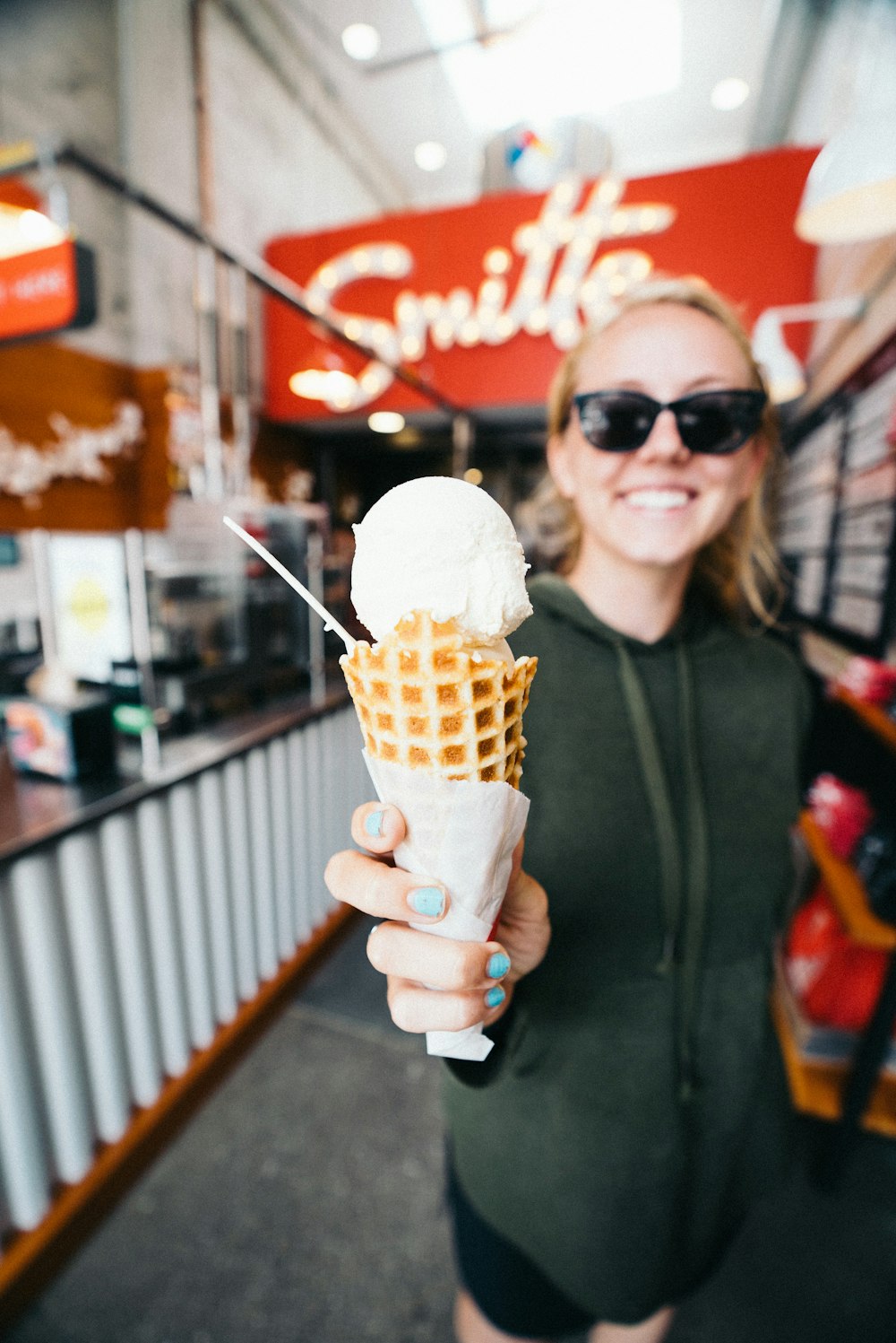 woman holding white ice cream