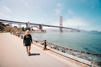 woman walking near Golden Gate Bridge