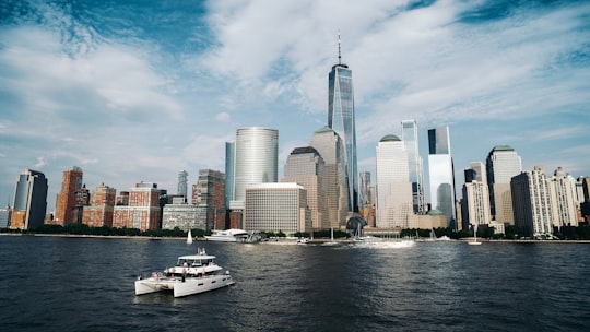 Freedom Tower under blue and white sky during daytime in J Owen Grundy Park United States