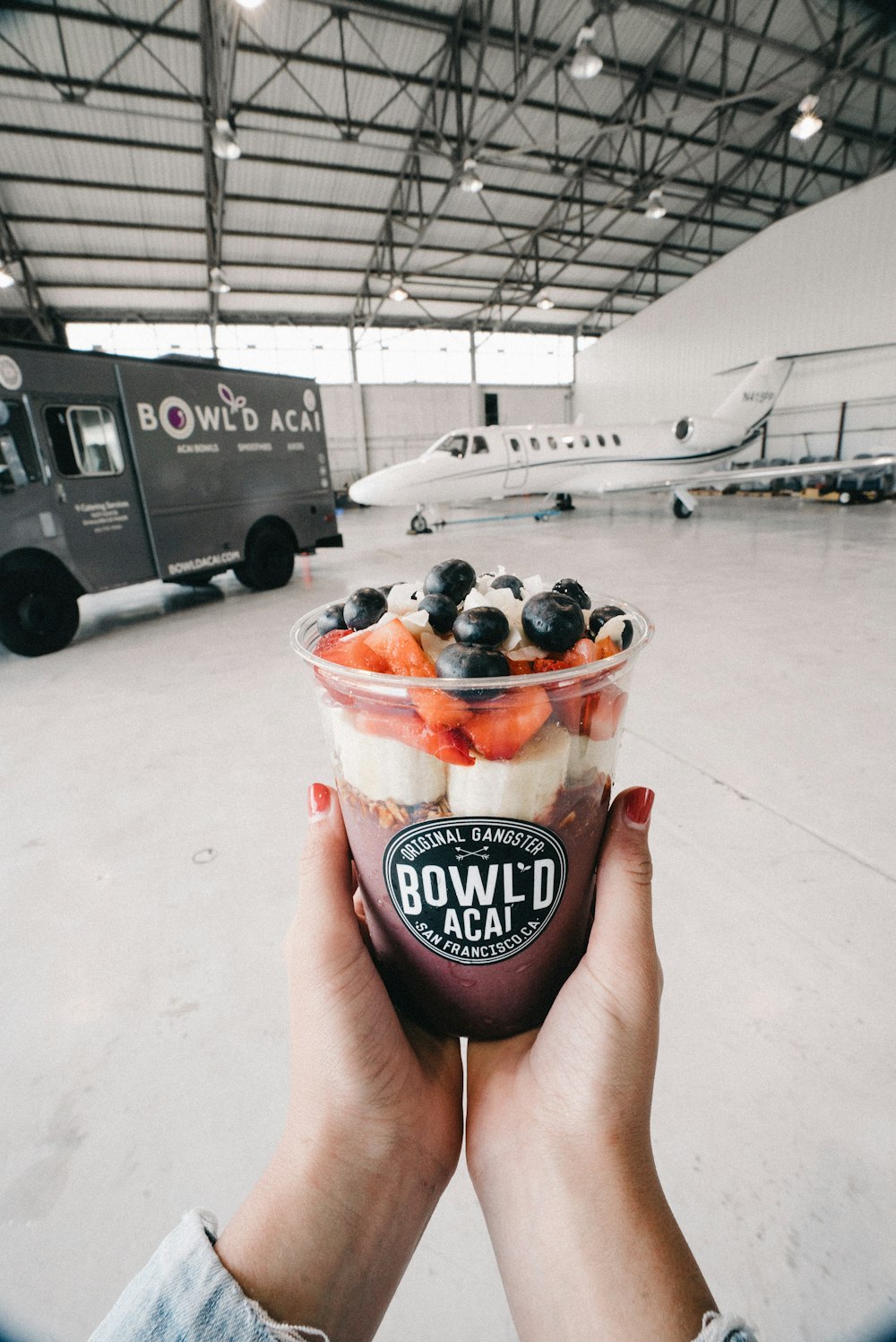 person holding Bowl'D acai cup