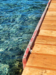 Close-up of a classic wooden pier cap on a sunny day.