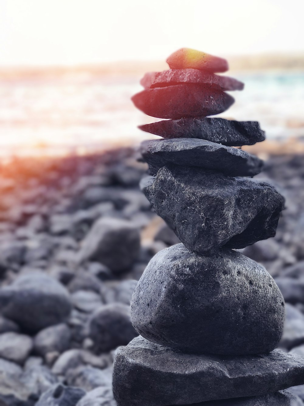stack of stones near seashore at daytime