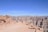 A happy tourist group enjoying a guided tour at the Edge of the World in Saudi Arabia.