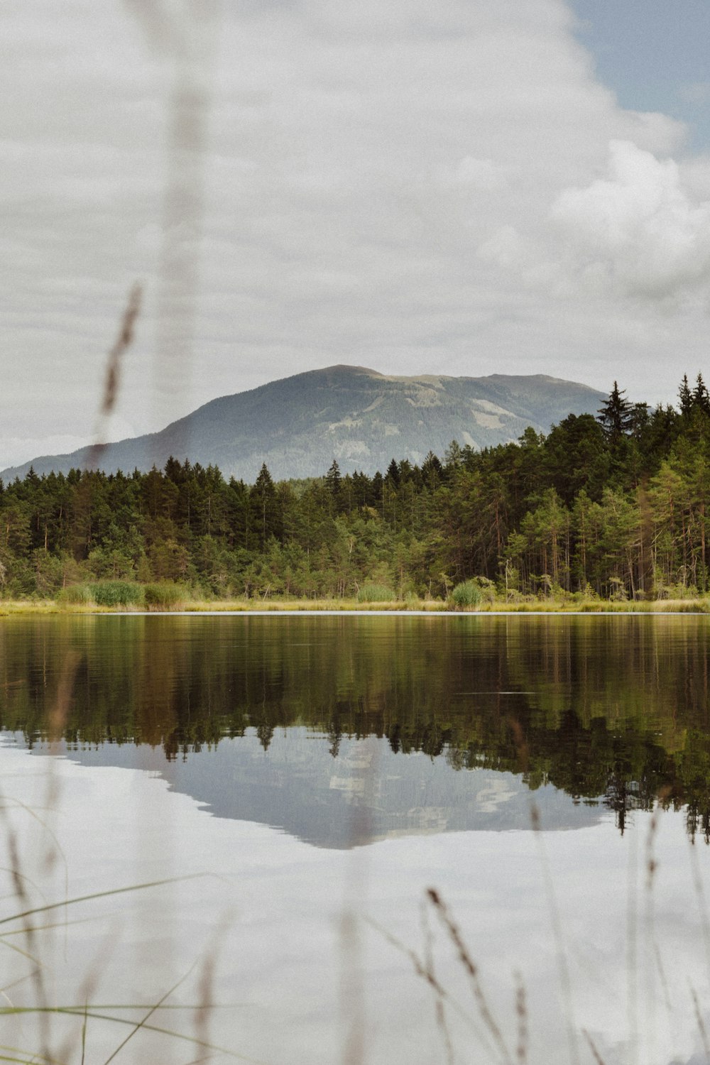 long exposure photography of lake near mountain