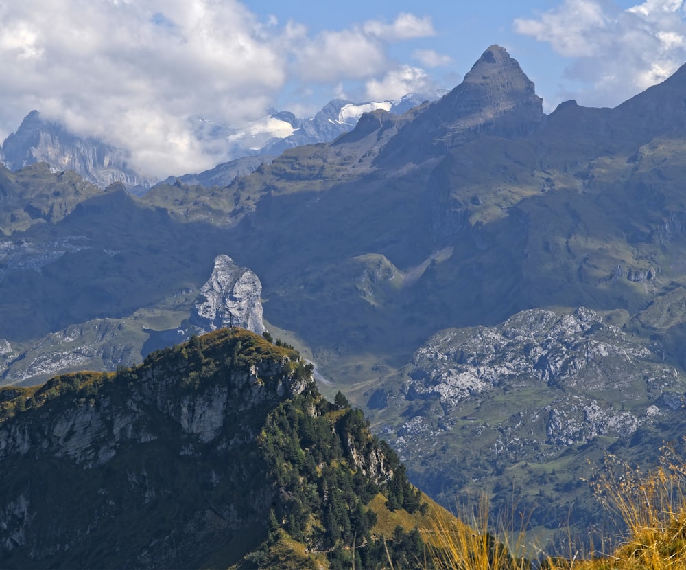 mountains under white clouds