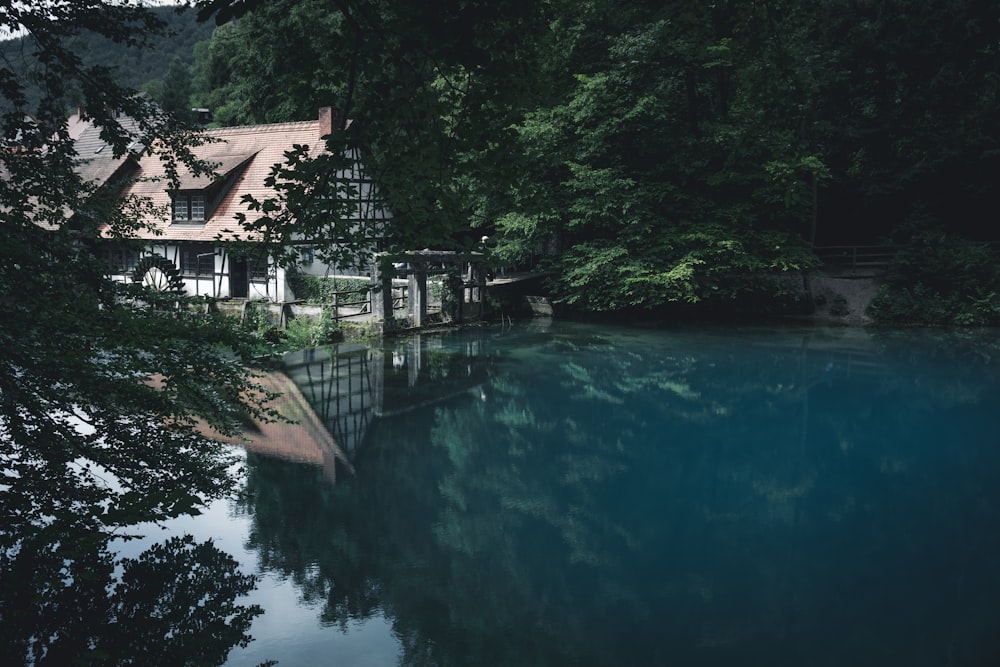 beige and white house near water