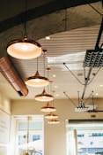 several turned on pendant lamps
