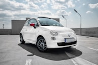 white 3-door hatchback on gray floor