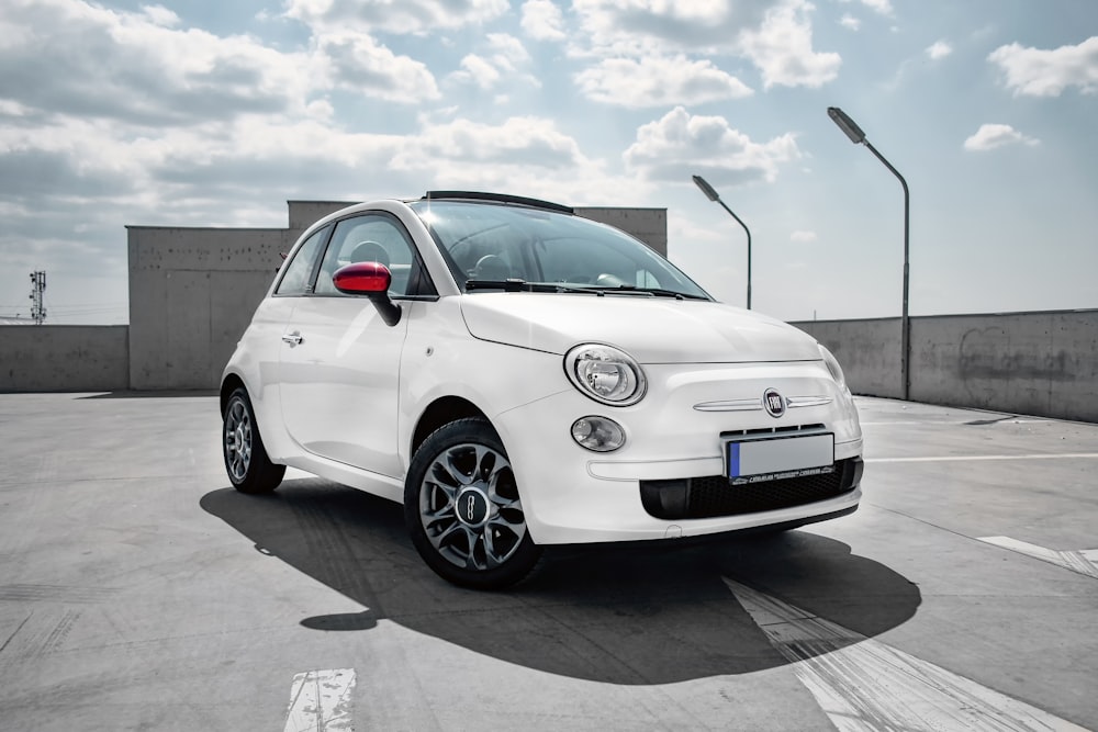 white 3-door hatchback on gray floor